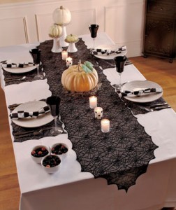 Dress your dining room for your Halloween celebration with this spooky 5-Pc. Spiderweb Lace Table Set.