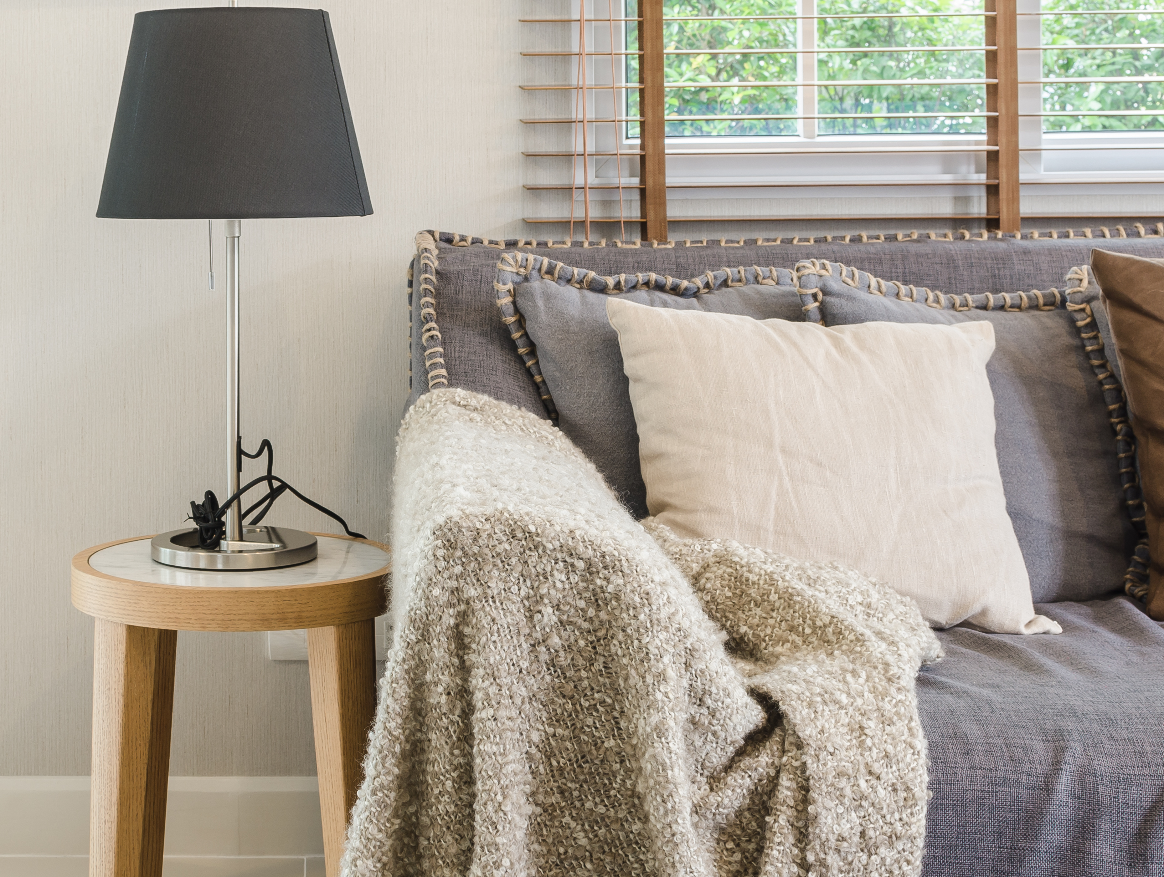 brown-blanket-on-sofa-in-living-room