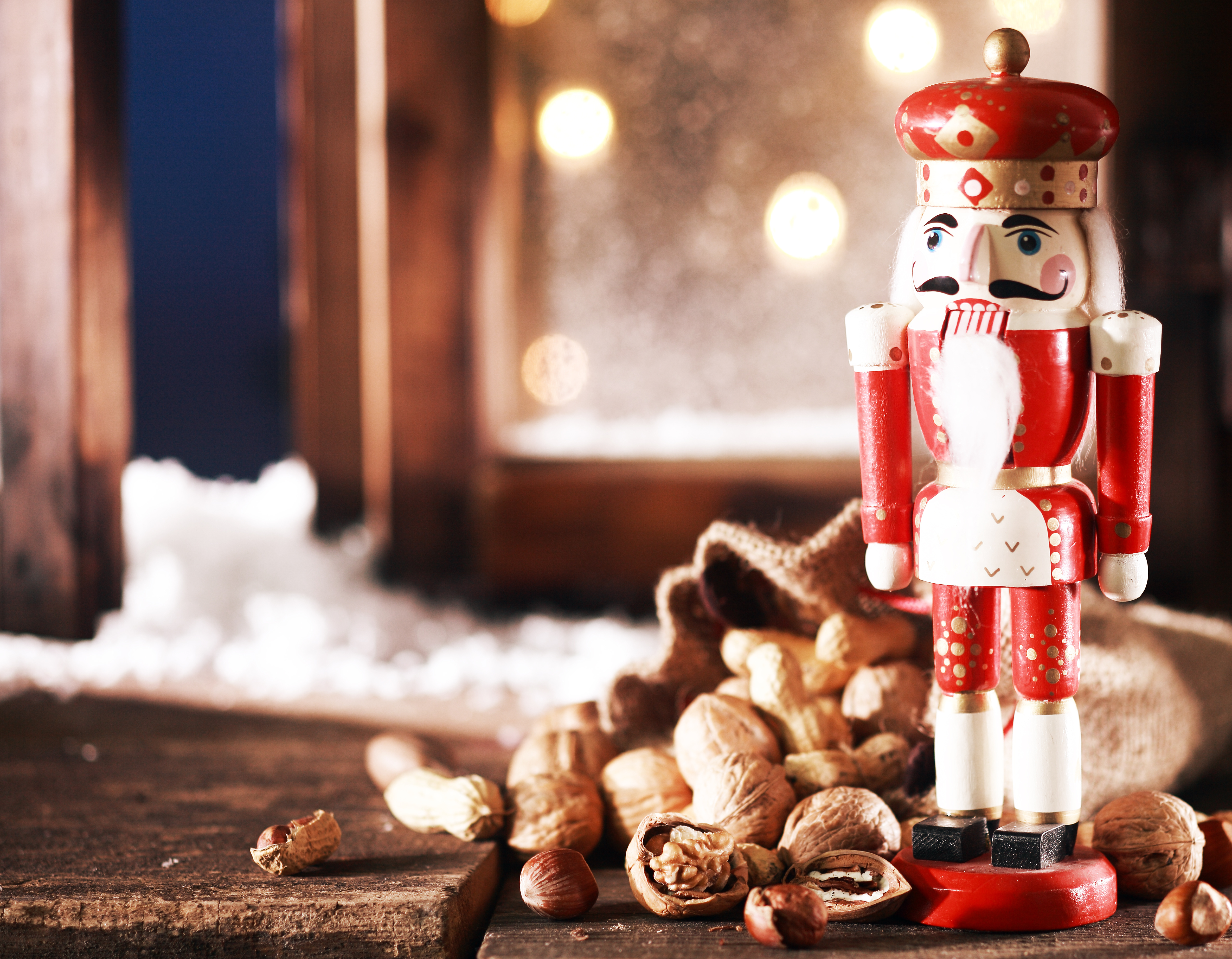 nutcracker-and-nuts-on-wooden-table