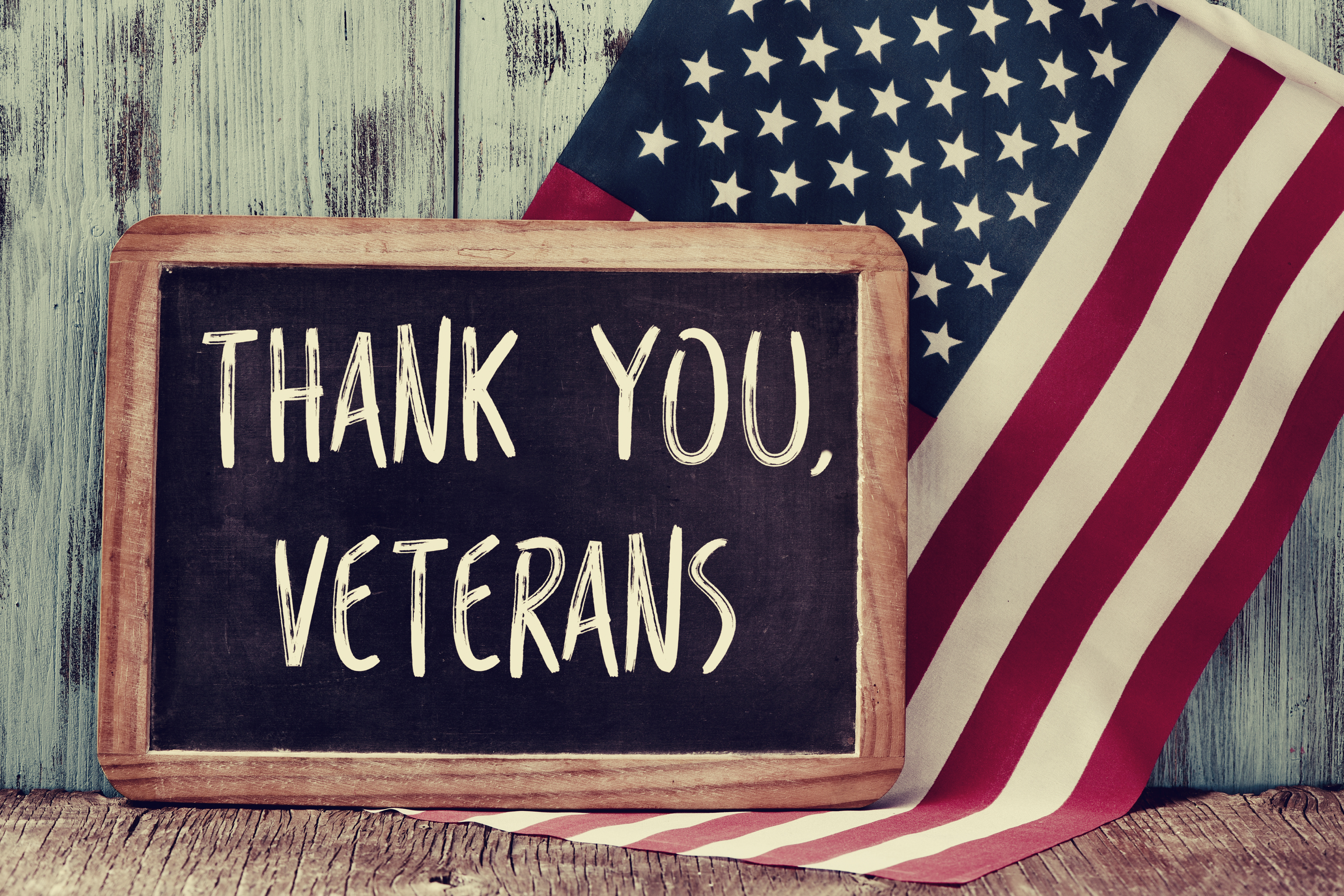 thank-you-veterans-chalkboard-with-american-flag-background