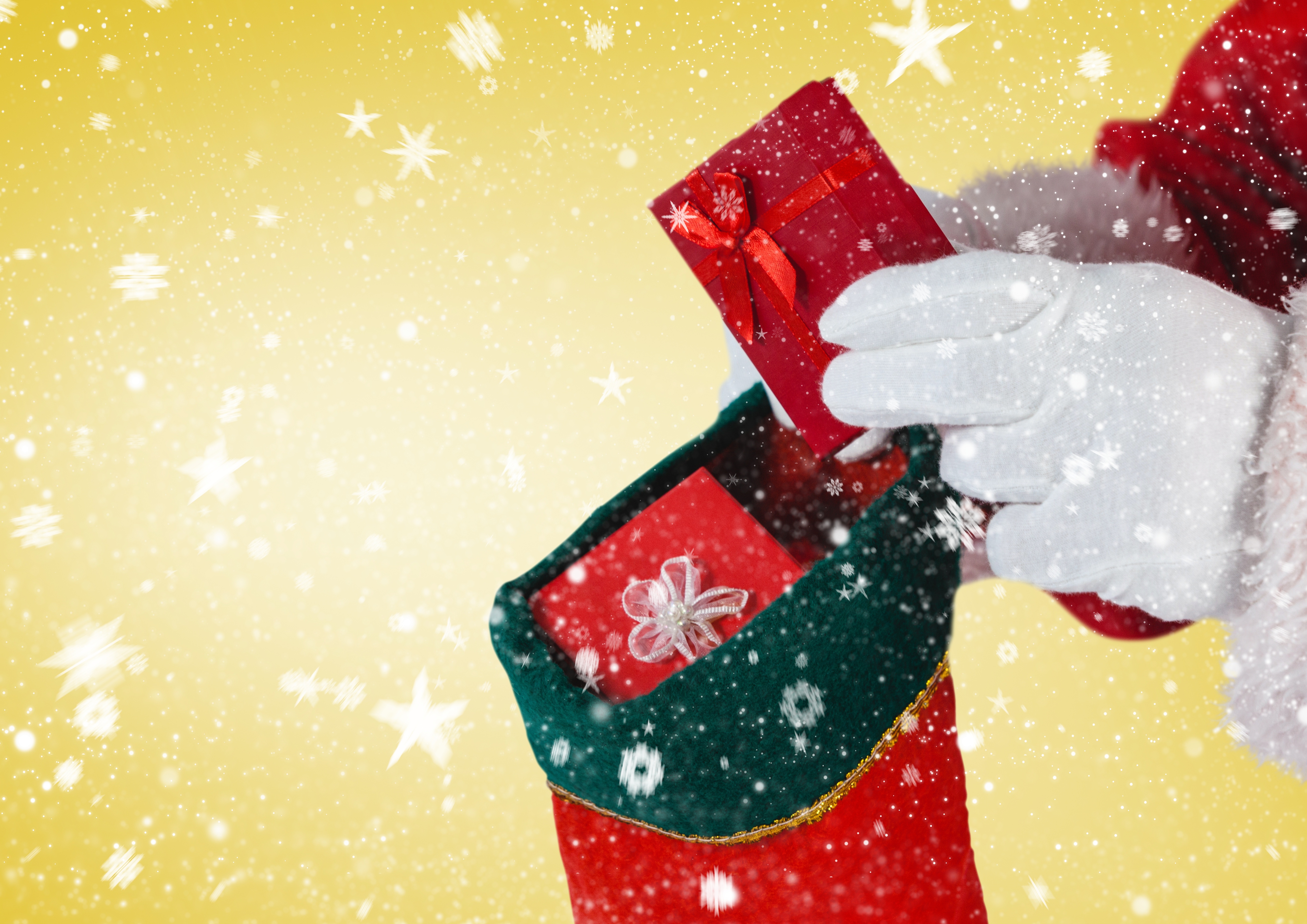 santa-putting-gifts-in-Christmas-stocking